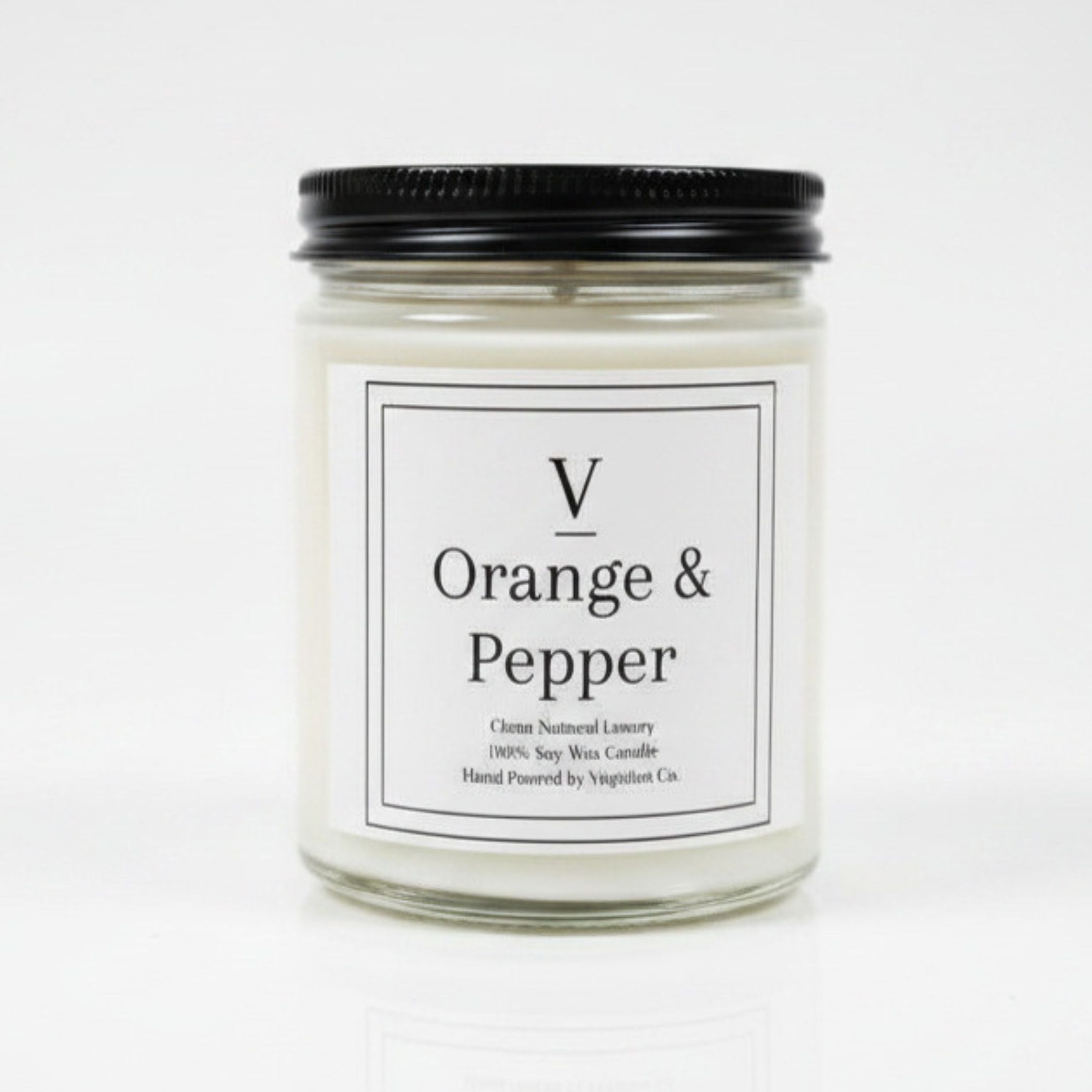 Orange and pepper clean soy candle in minimalist glass jar