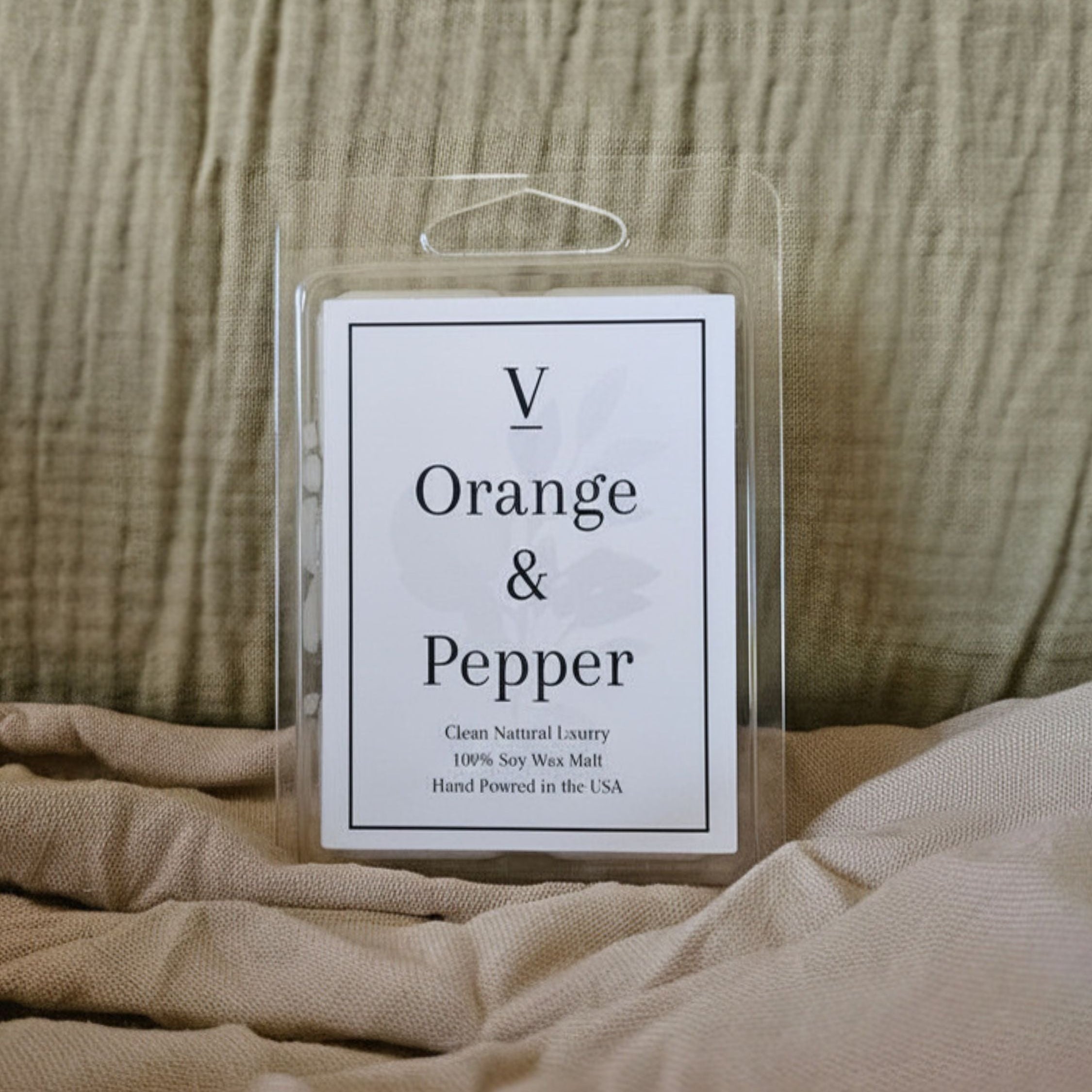 Luxury orange and pepper wax melt flameless in cozy modern home