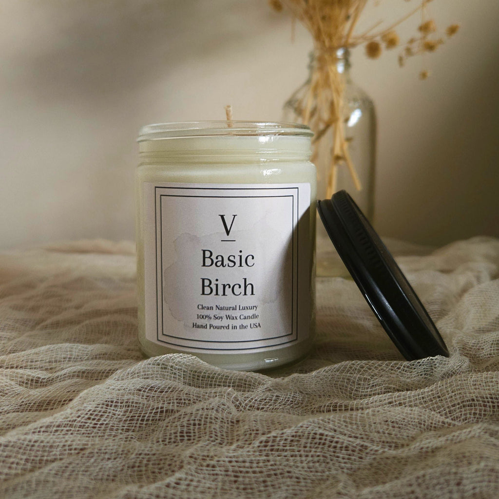 Luxury birch candle aesthetic with clean wood fragrance and neutral decor