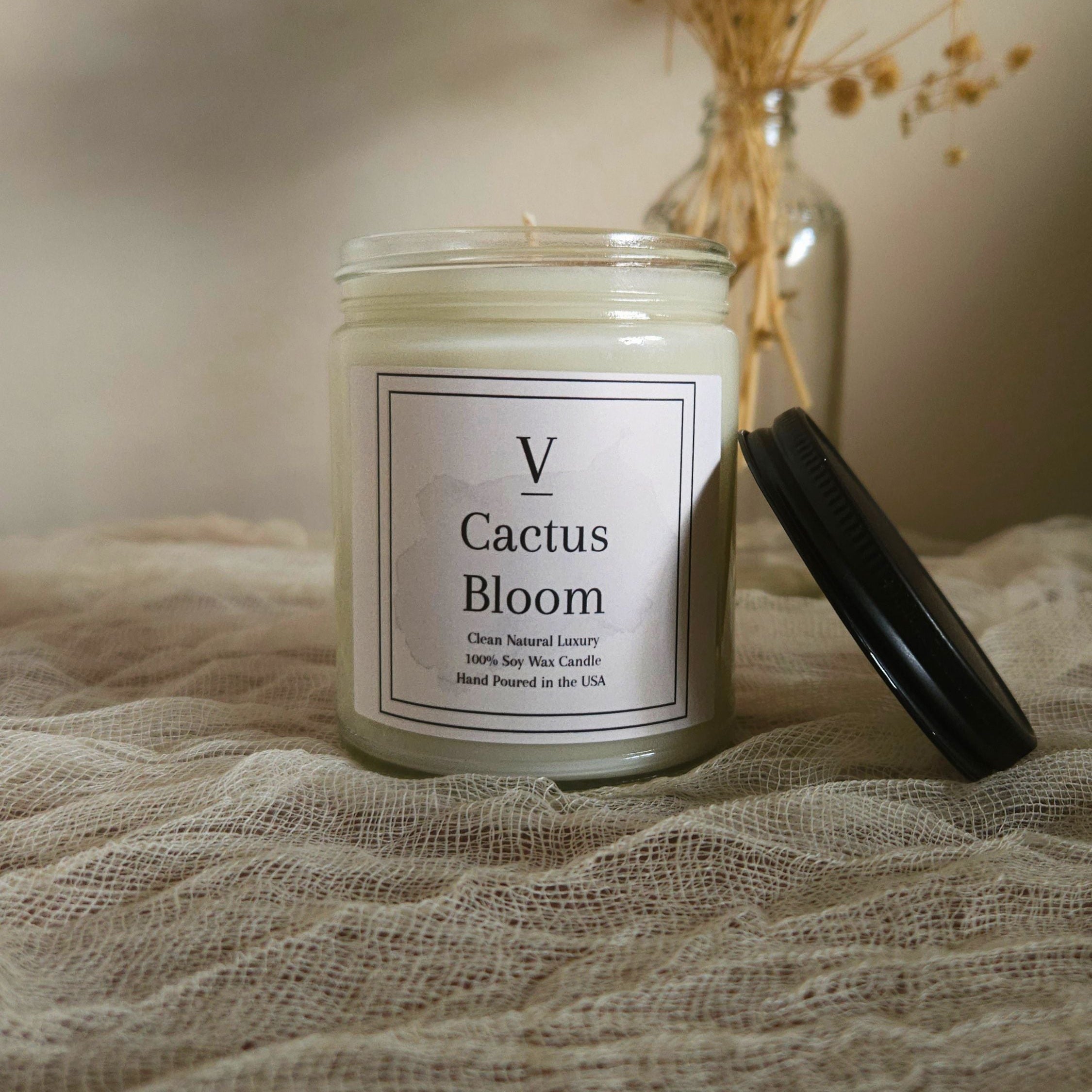 Luxury botanical candle aesthetic inspired by desert flowers and warm sunlight