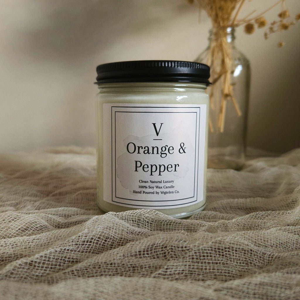 Orange and pepper soy candle with bright citrus and warm spice fragrance notes