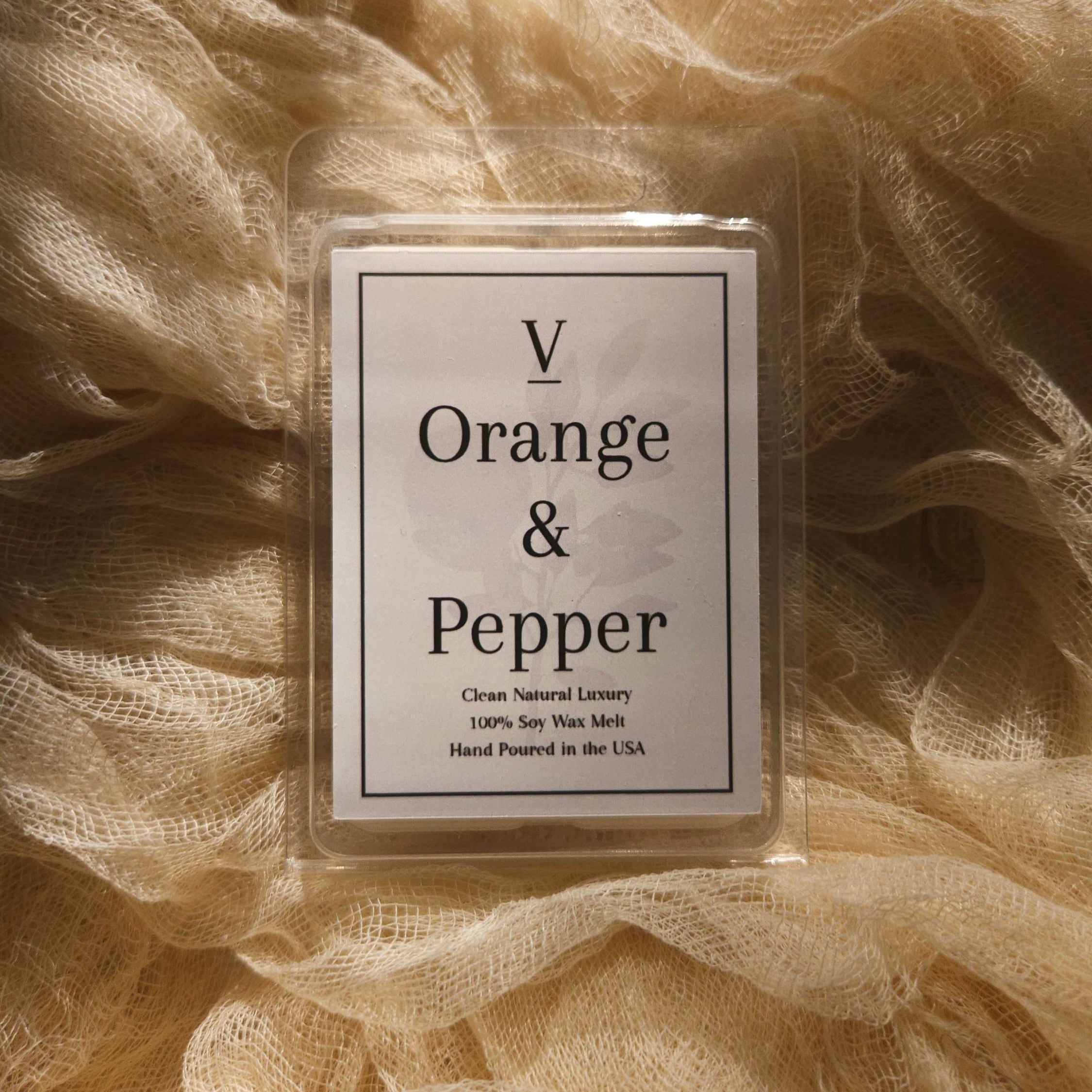 Luxury orange and pepper wax melt aesthetic with warm citrus home fragrance
